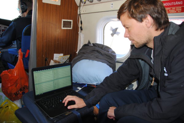Looking at data during aerial survey. Photo: Rikke Guldborg Hansen