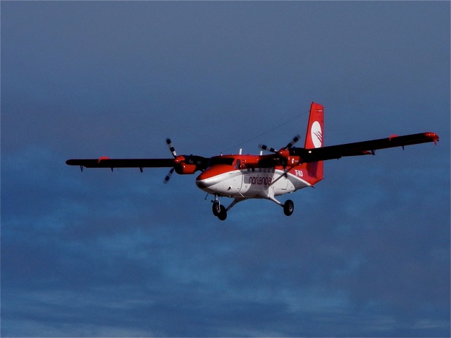 Twin Otter used in aerial surveys, landing in Qaanaaq, Greenland. © Hans Jensen.